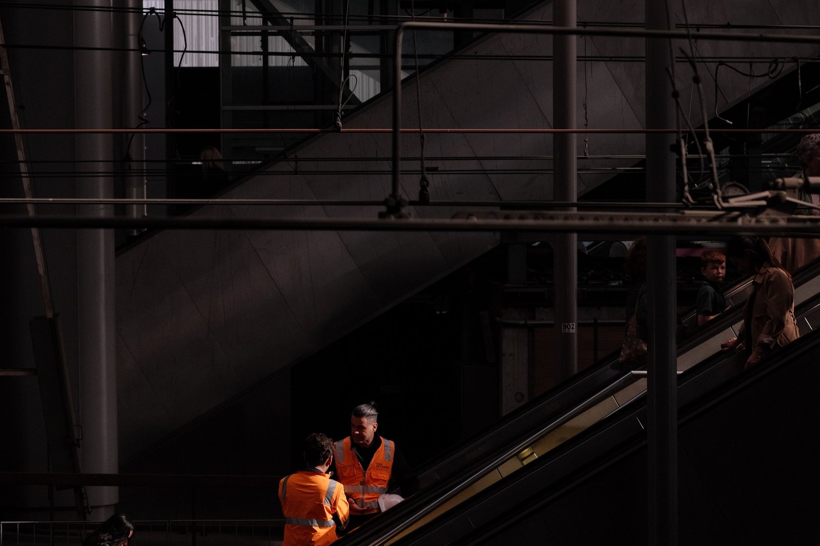 Field technicians in safety vests at a commercial site