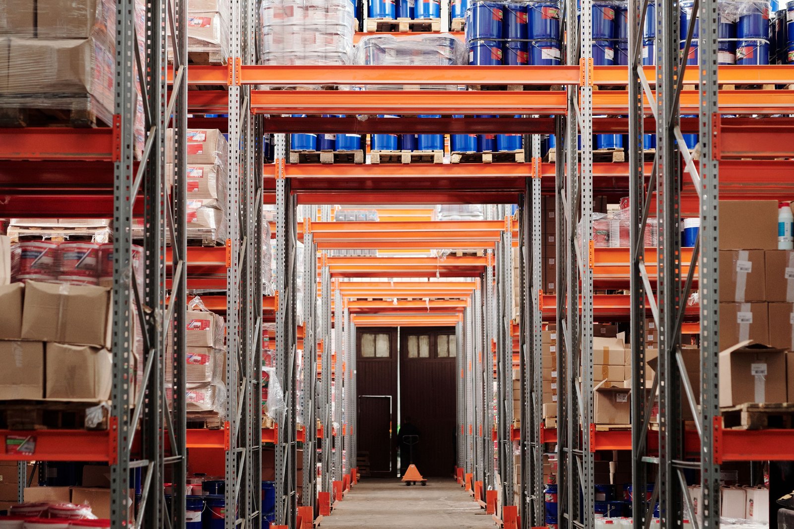 Warehouse distribution facility aisle with stocked shelving